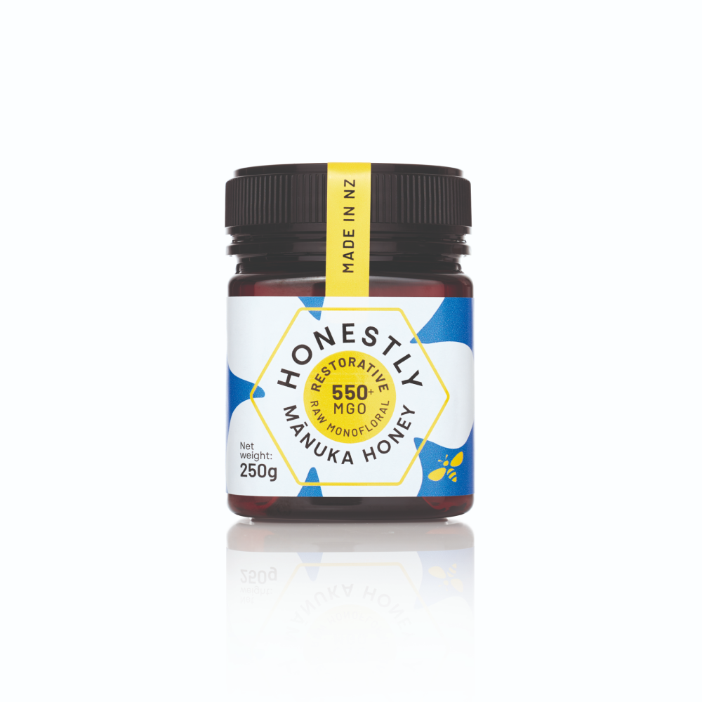 550+ MGO Manuka honey jar with a white label on a white background