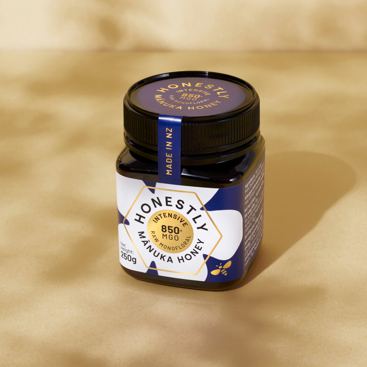850+ MGO Manuka Honey on a cloudy gold background