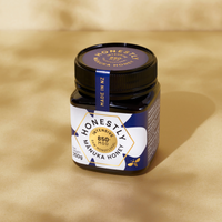 850+ MGO Manuka Honey on a cloudy gold background